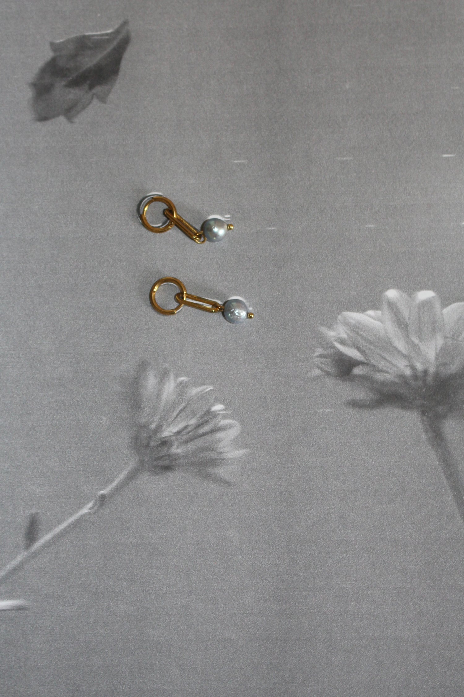 Rules of Raine handmade jewelry, goldplated stainless steel earrings with removable fresh water pearl charms. Blue upcycled fresh water pearls 